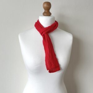 A red skinny scarf made of quality prewashed robust linen fabric.