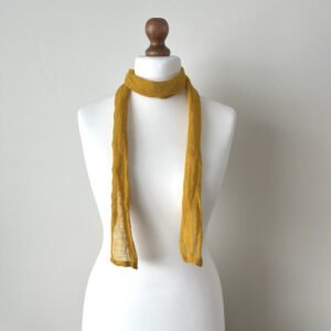 Skinny mustard yellow scarf handmade of 100% linen, softened, lightweight, translucent fabric with a loose open weave.