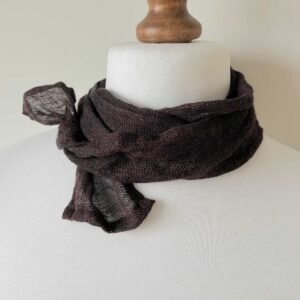 A skinny dark brown gauze linen scarf loosely wrapped around a white mannequin neck.