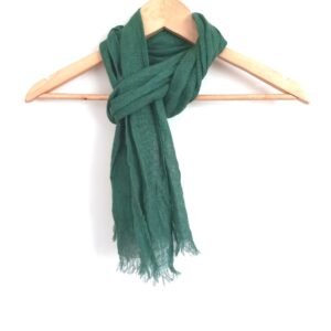 Forest green unisex linen scarf draped on a wooden hanger against a white background.